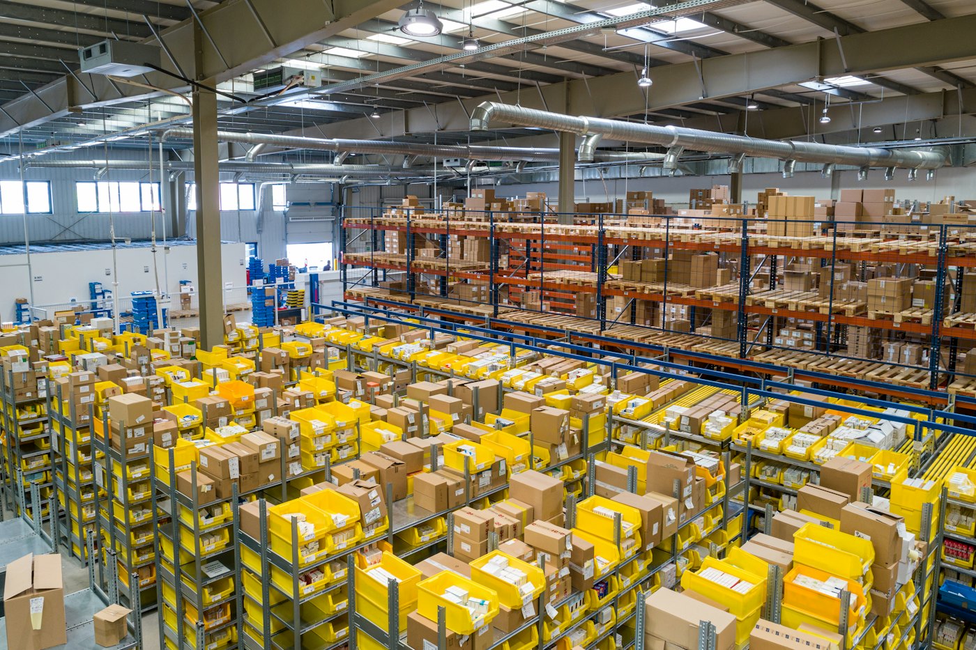 A distribution warehouse with stacked inventory